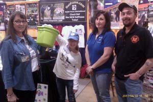 Tyra pulls the microchip winner out of the hat as witnesses look on. OEAmicrochip drawing-jamiekauffmanwinner.jpg